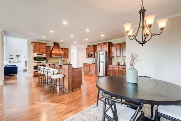 a living room with furniture and a view of kitchen