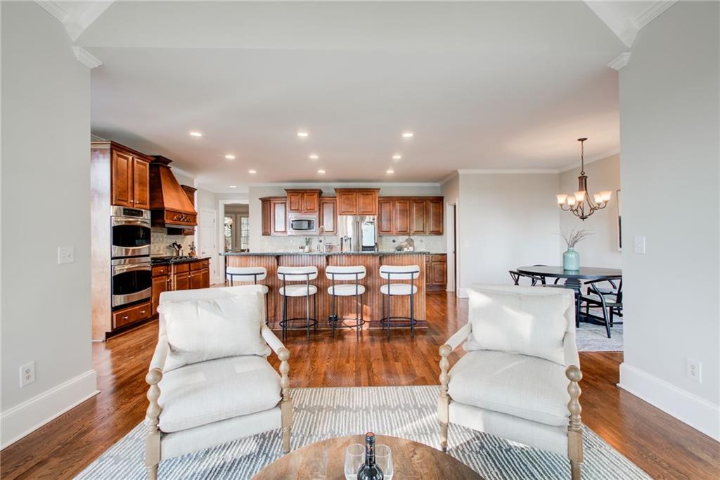 322 Tupelo Trail Canton, GA 30114 - Photo 22 of 118 a living room with furniture and a view of kitchen