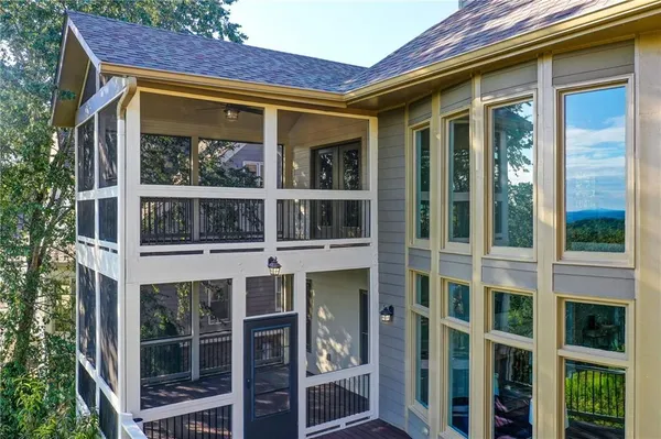 a bedroom with a bed and ceiling fan