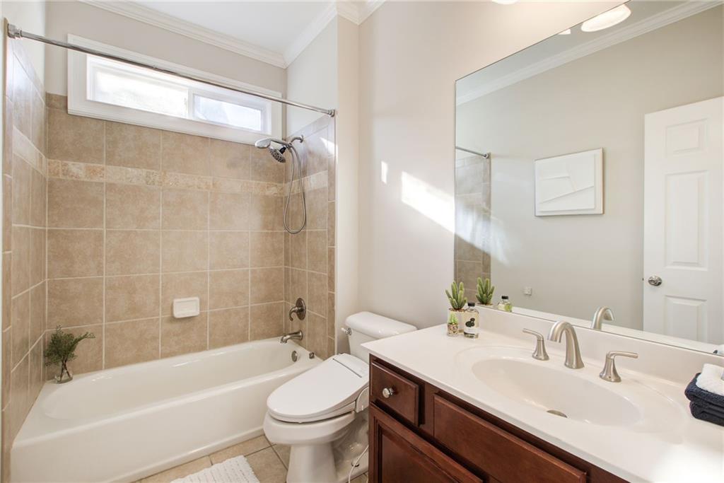 322 Tupelo Trail Canton, GA 30114 - Photo 35 of 118 a bathroom with a sink mirror toilet and bathtub