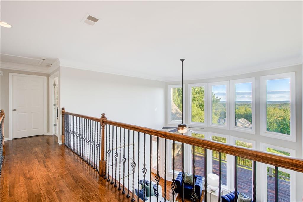 322 Tupelo Trail Canton, GA 30114 - Photo 40 of 118 a view of a room with wooden floor and windows
