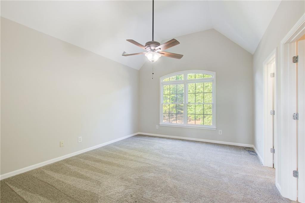 322 Tupelo Trail Canton, GA 30114 - Photo 53 of 118 a view of a room that has a window and ceiling fan