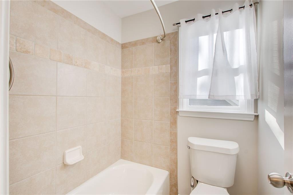 322 Tupelo Trail Canton, GA 30114 - Photo 60 of 118 a bathroom with a shower a toilet and a window