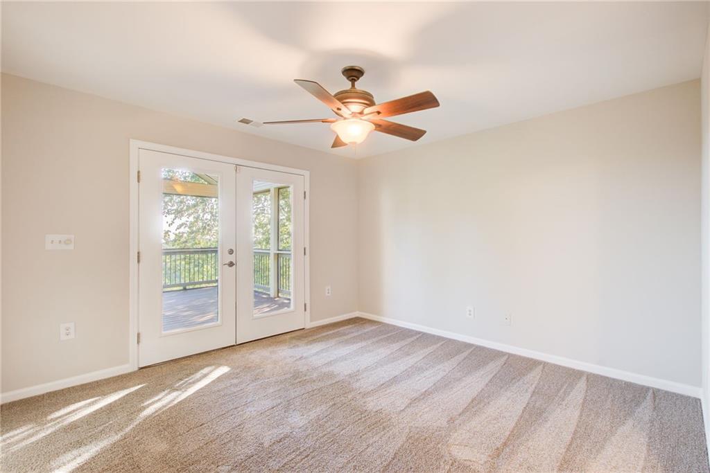 322 Tupelo Trail Canton, GA 30114 - Photo 63 of 118 a view of an empty room with a window