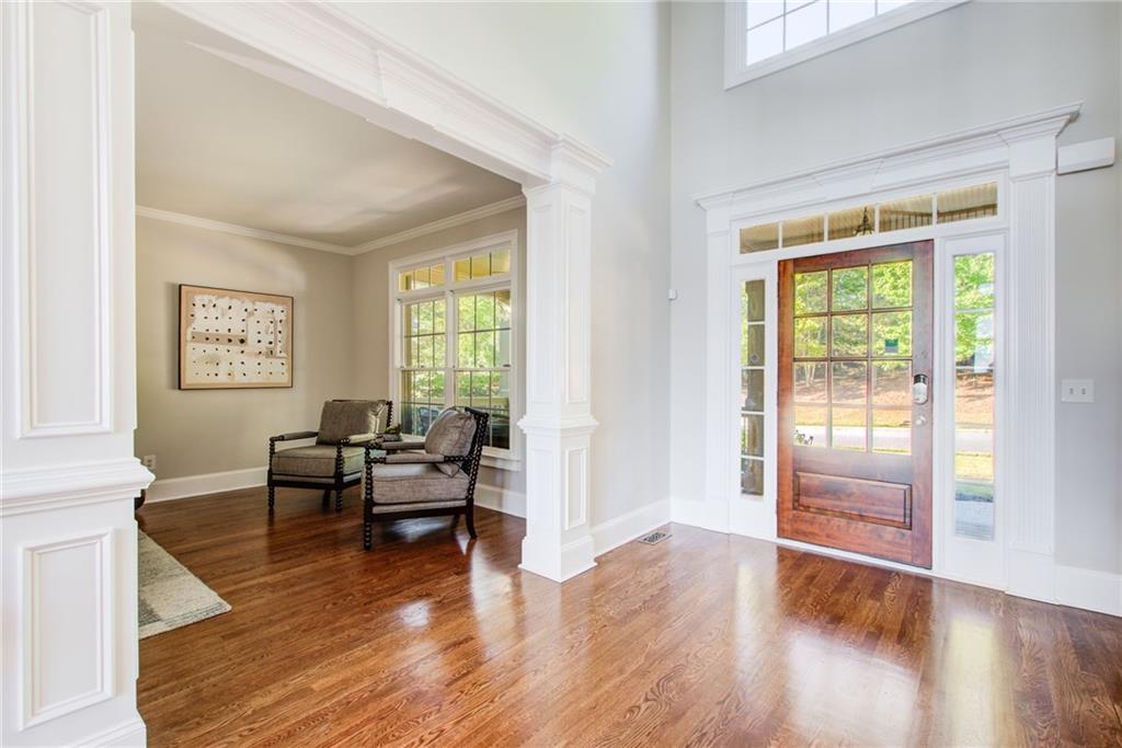 322 Tupelo Trail Canton, GA 30114 - Photo 7 of 118 a living room with furniture and a wooden floor