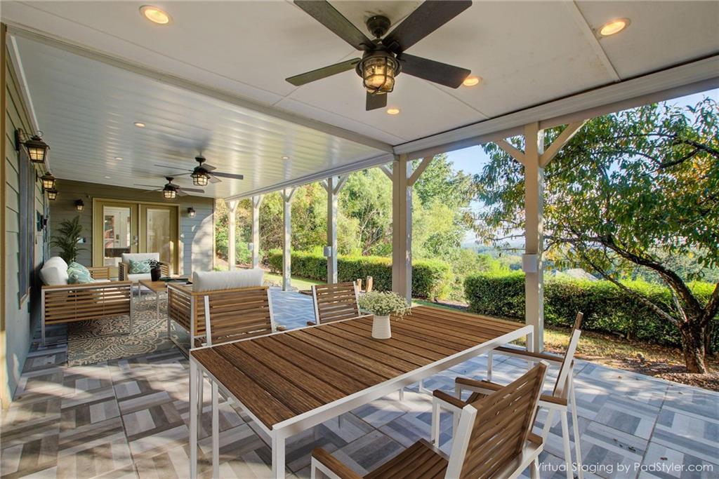 322 Tupelo Trail Canton, GA 30114 - Photo 97 of 118 a outdoor space with the couches and dining table with the garden view