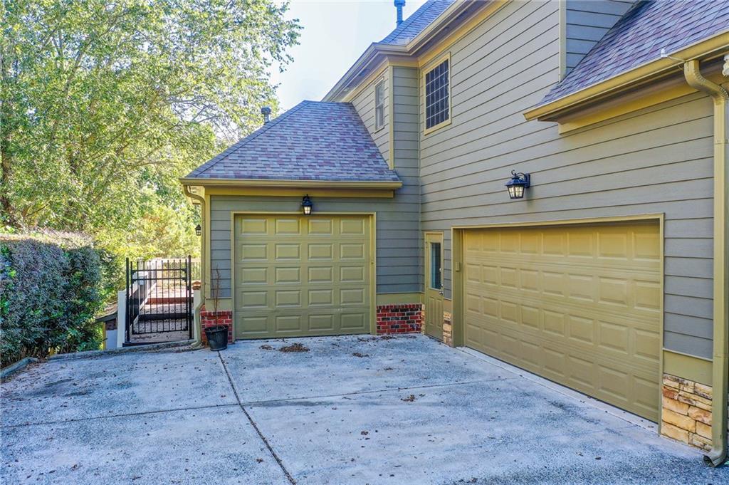 322 Tupelo Trail Canton, GA 30114 - Photo 100 of 118 a front view of a house with a garage