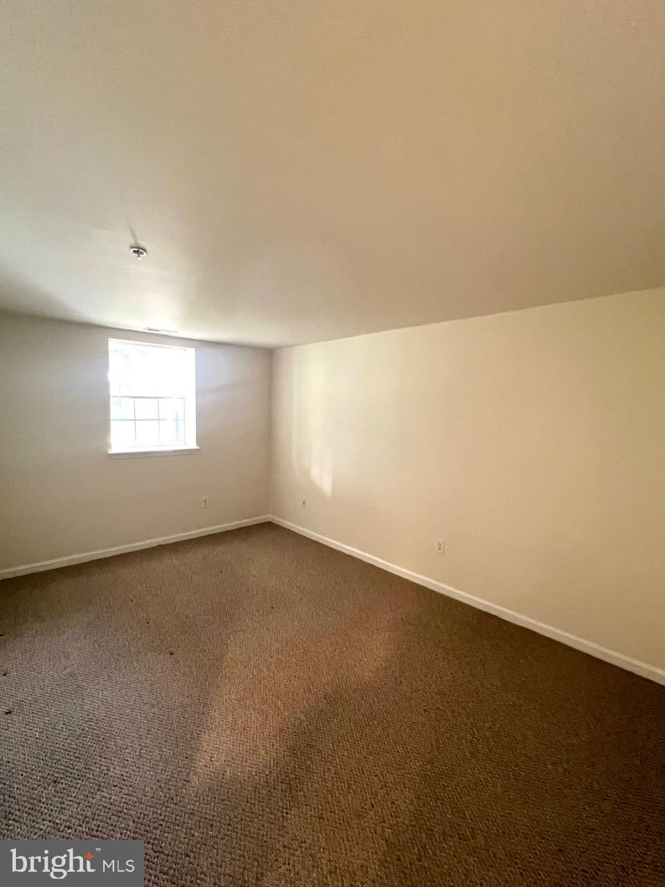 9702 Evening Bird Lane Laurel, MD 20723 - Photo 11 of 28 an empty room with a window