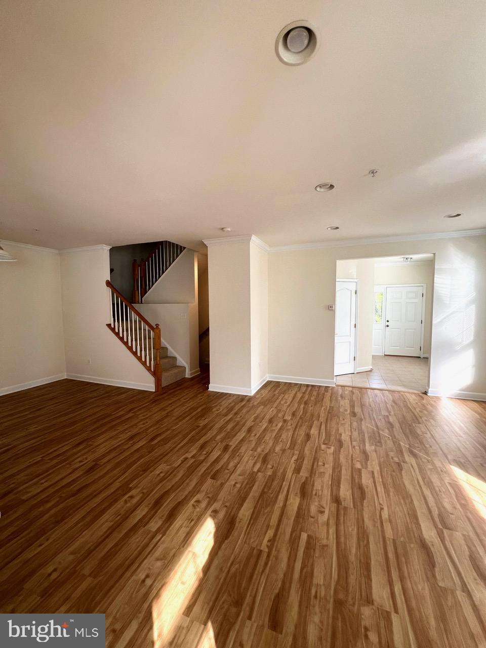 9702 Evening Bird Lane Laurel, MD 20723 - Photo 16 of 28 a view of a room with wooden floor and a sink