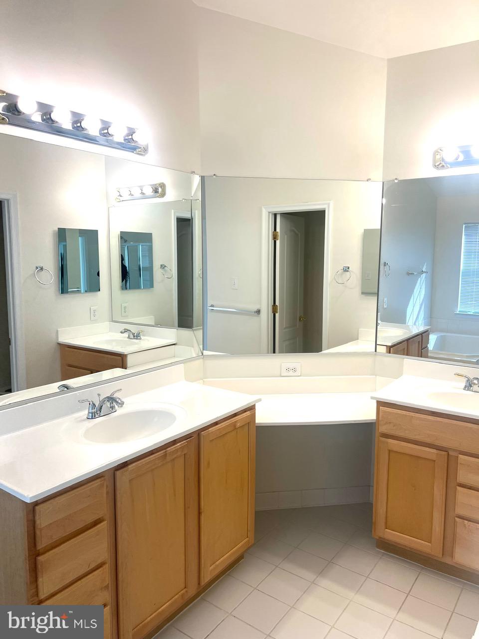 9702 Evening Bird Lane Laurel, MD 20723 - Photo 20 of 28 a bathroom with a sink and a mirror