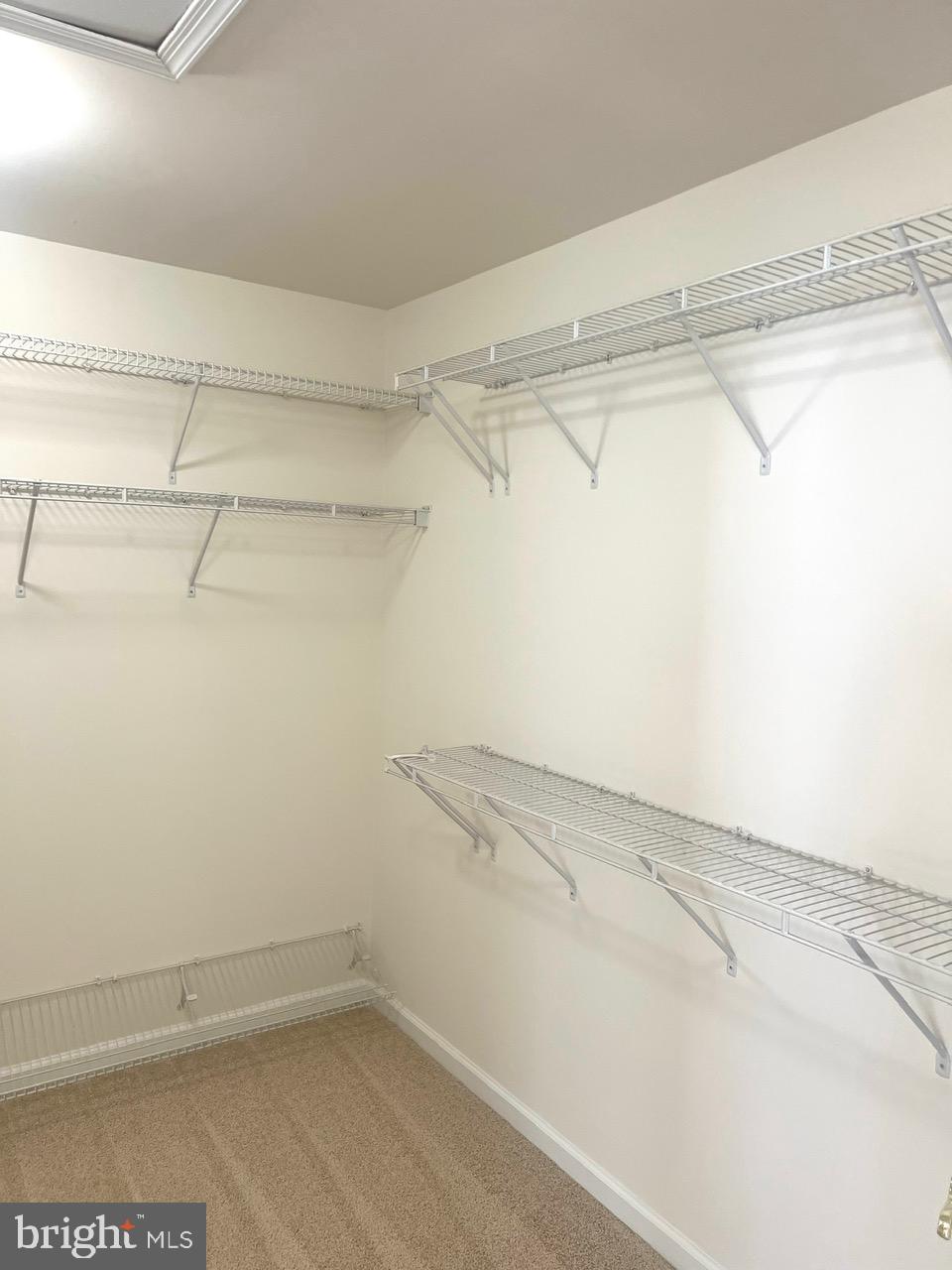 9702 Evening Bird Lane Laurel, MD 20723 - Photo 24 of 28 a view of a room with racks on the wall
