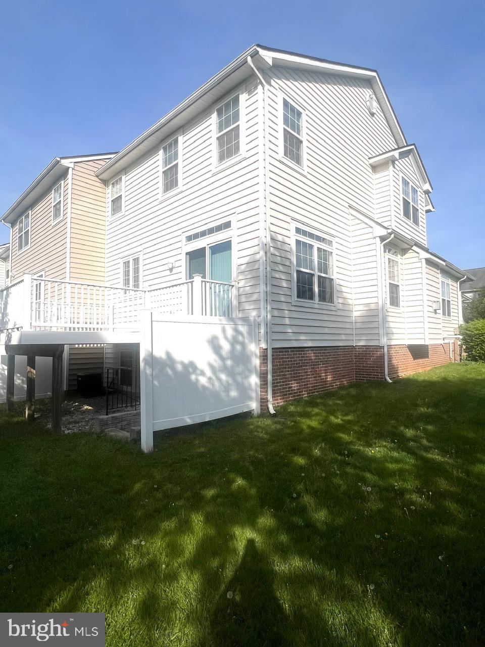9702 Evening Bird Lane Laurel, MD 20723 - Photo 4 of 28 a front view of a house with a yard
