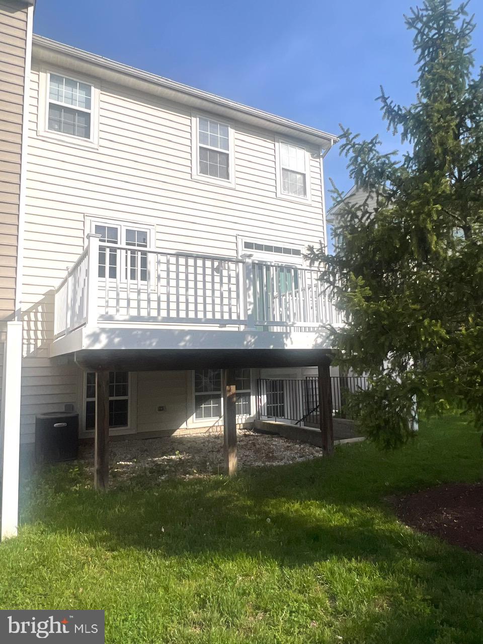 9702 Evening Bird Lane Laurel, MD 20723 - Photo 5 of 28 a front view of a house with a yard