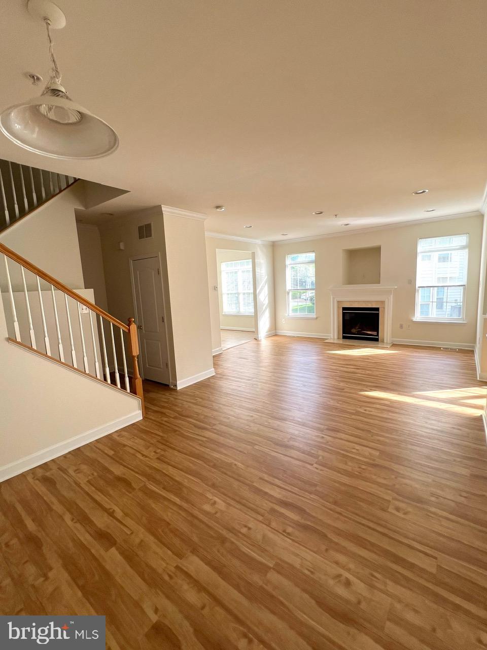9702 Evening Bird Lane Laurel, MD 20723 - Photo 28 of 28 a view of a livingroom with wooden floor and fireplace