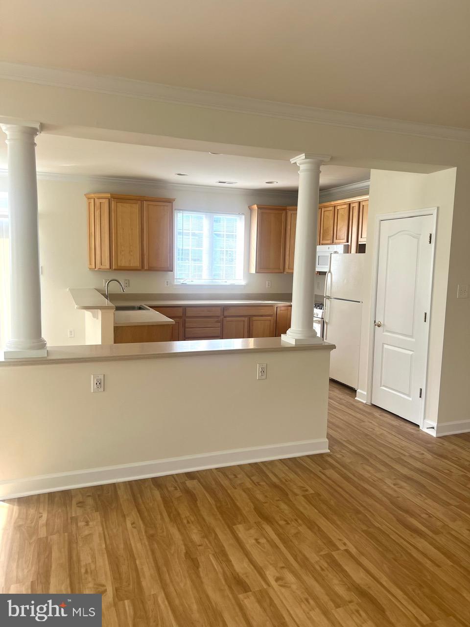 9702 Evening Bird Lane Laurel, MD 20723 - Photo 9 of 28 a view of kitchen with wooden floor and seating space