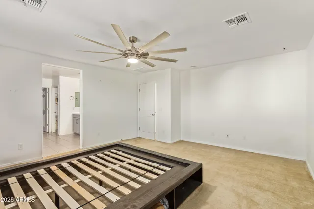 a view of walk in closet with clothes
