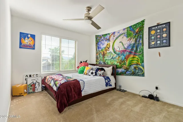 a view of an house with backyard space and balcony
