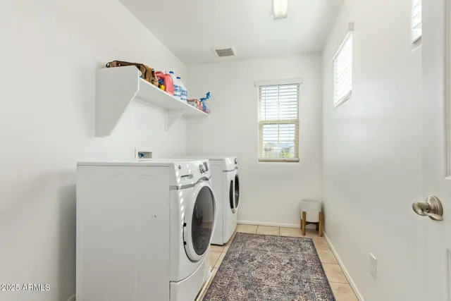 a view of a swimming pool with an outdoor seating and a garden