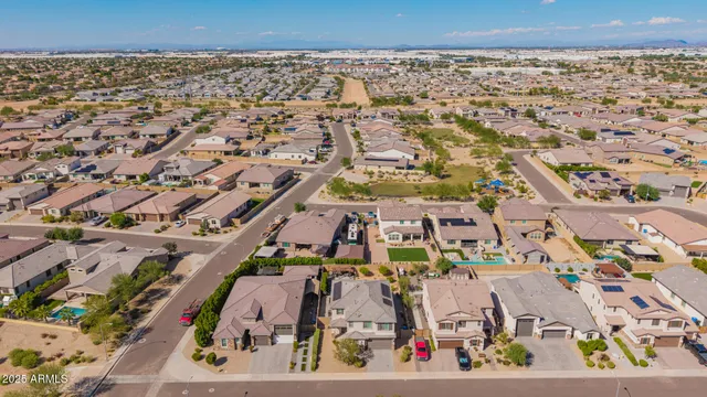 an aerial view of a house with a yard