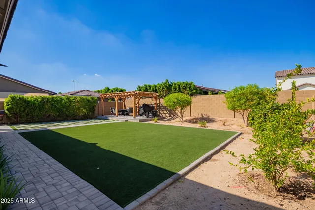 a aerial view of a house with table and chairs