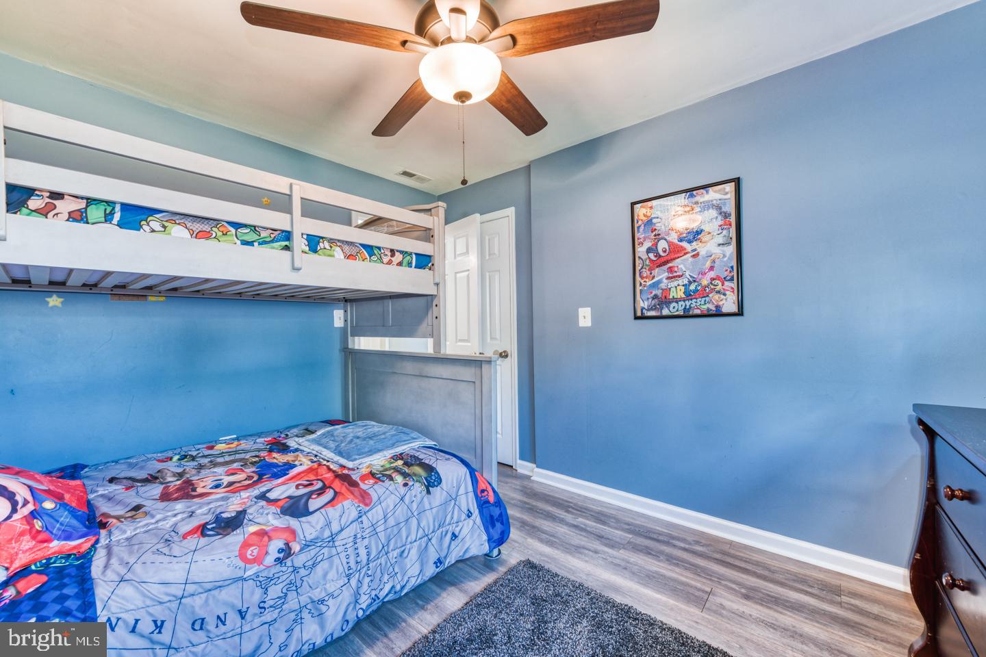 12 Goodturn Road Levittown, PA 19057 - Photo 12 of 20 a bedroom with a bed and a chandelier