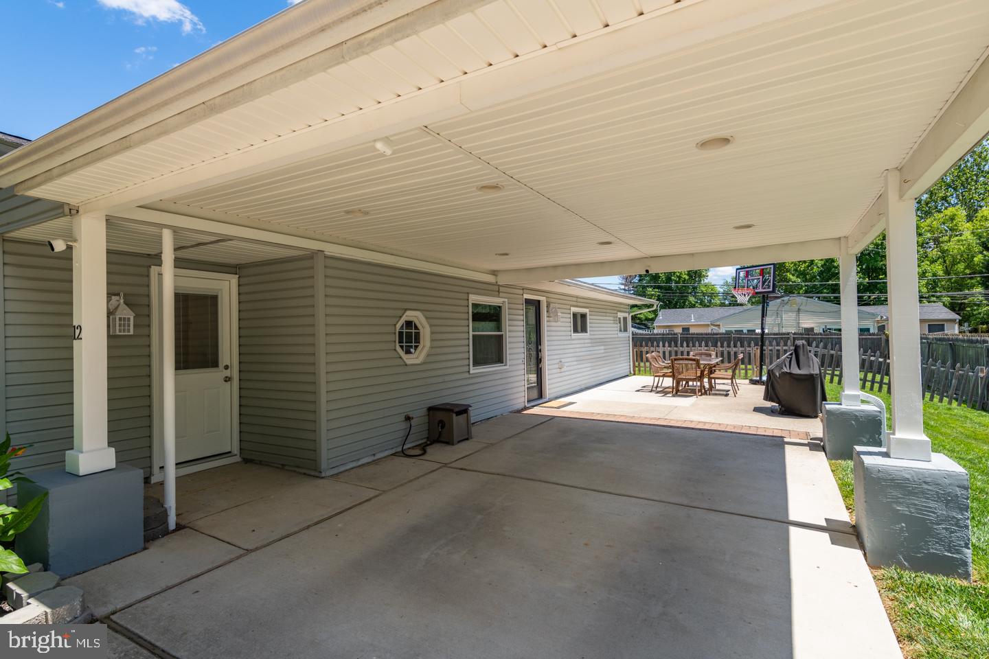 12 Goodturn Road Levittown, PA 19057 - Photo 17 of 20 a view of a patio with table and chairs potted plants