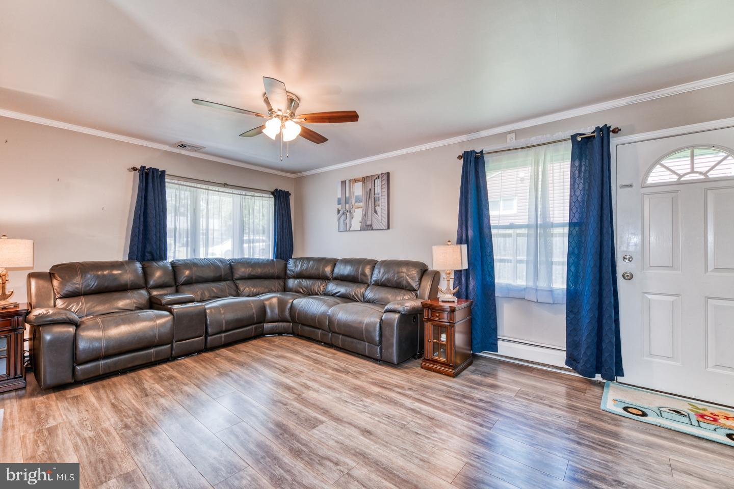 12 Goodturn Road Levittown, PA 19057 - Photo 7 of 20 a living room with furniture and a wooden floor
