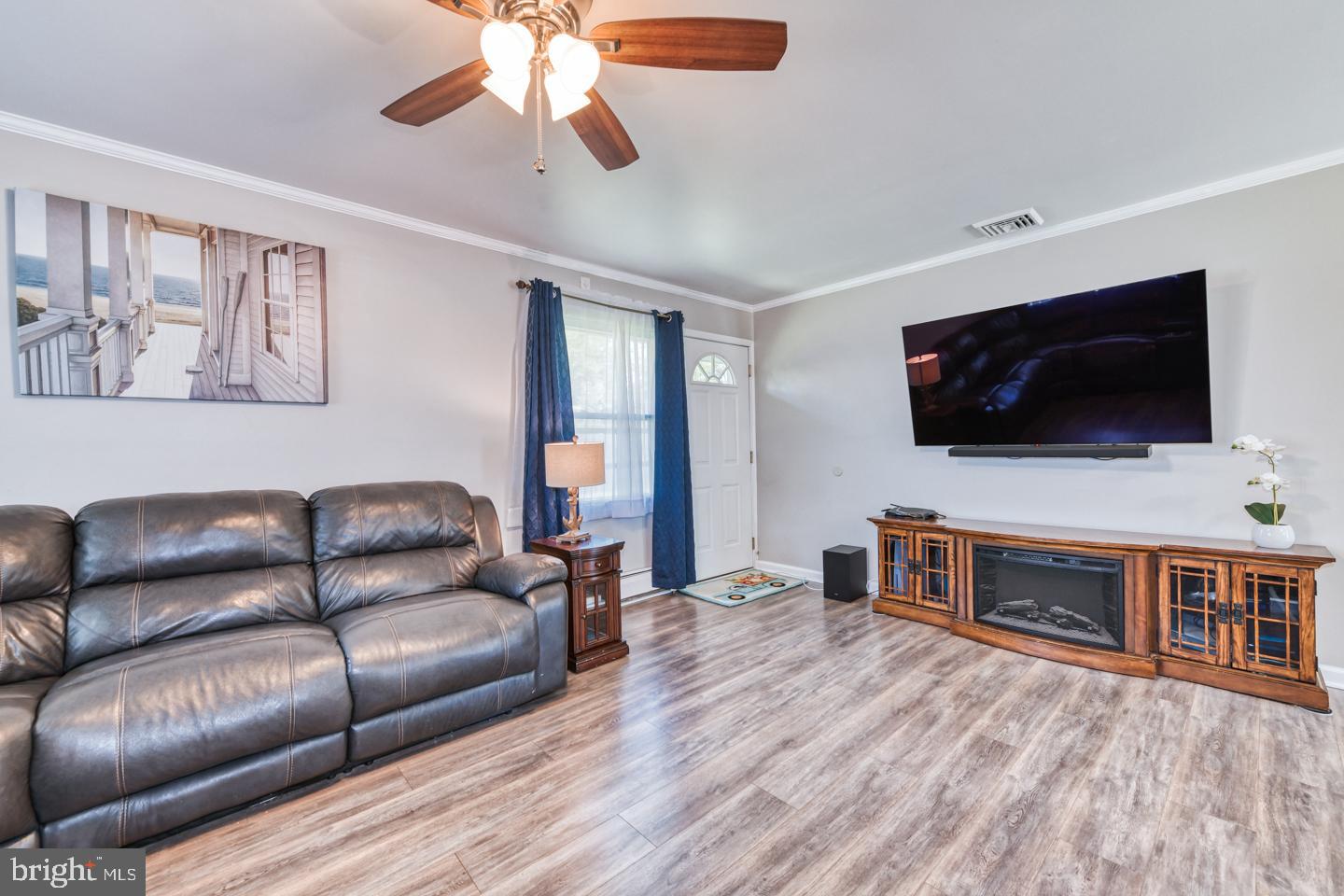 12 Goodturn Road Levittown, PA 19057 - Photo 9 of 20 a living room with furniture and a flat screen tv