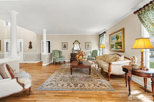 a living room with furniture kitchen view and a fireplace