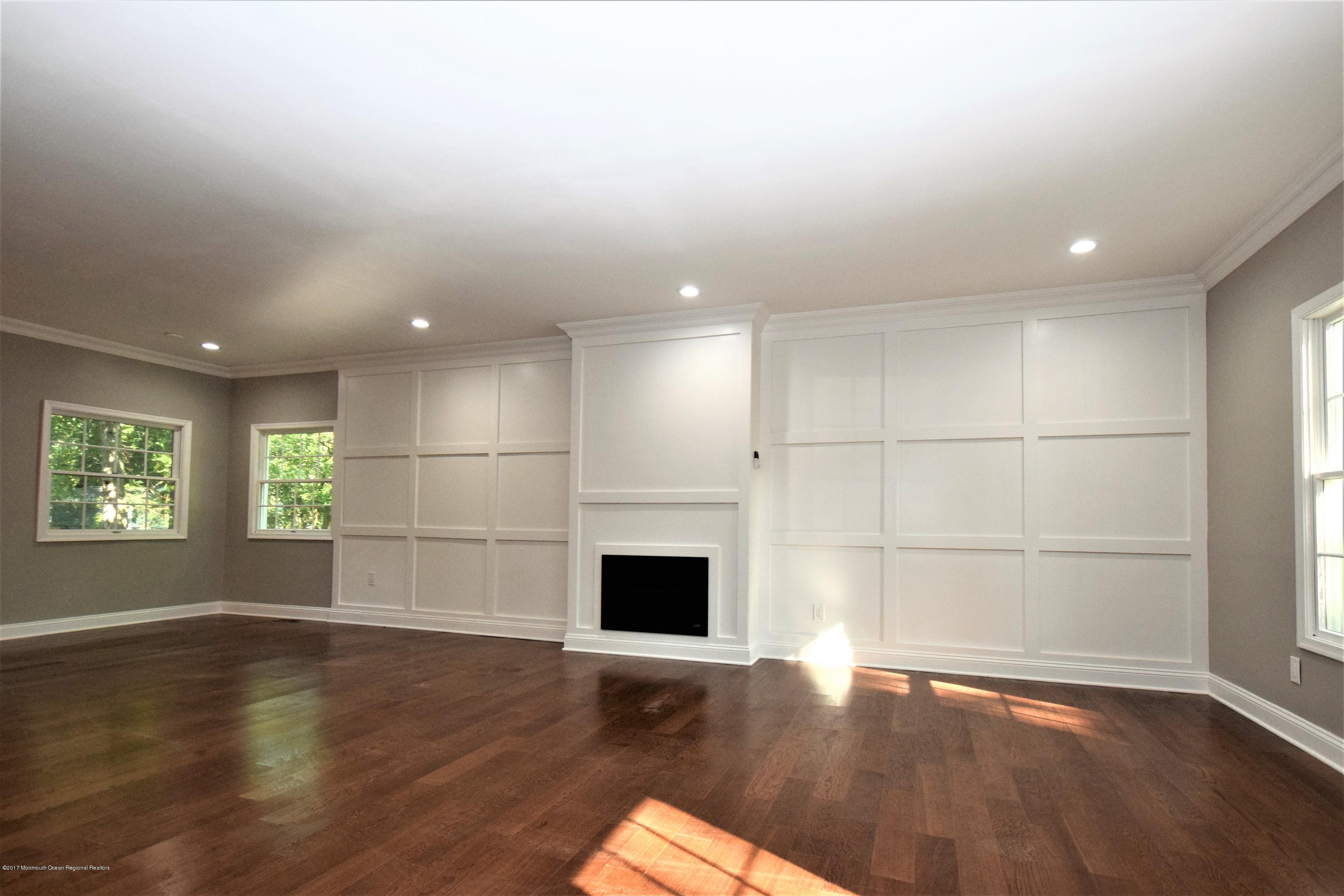 40 Frank Applegate Road Jackson, NJ 08527 - Photo 22 of 55 an empty room with wooden floor and windows