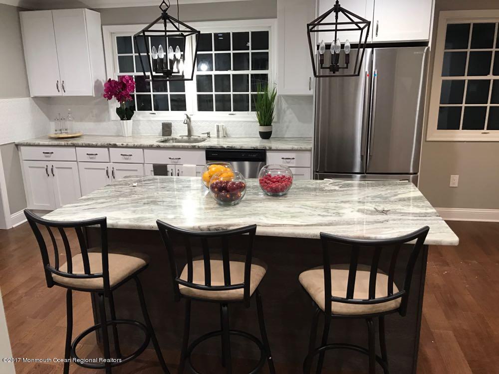 40 Frank Applegate Road Jackson, NJ 08527 - Photo 8 of 55 a dining table with chairs and wooden floor