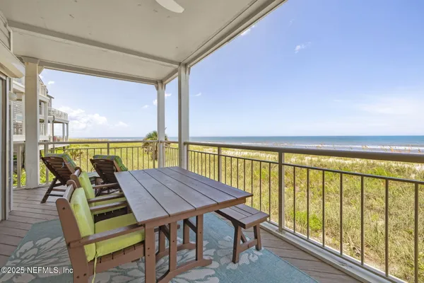 a large kitchen with cabinets a sink a counter space stainless steel appliances and cabinets