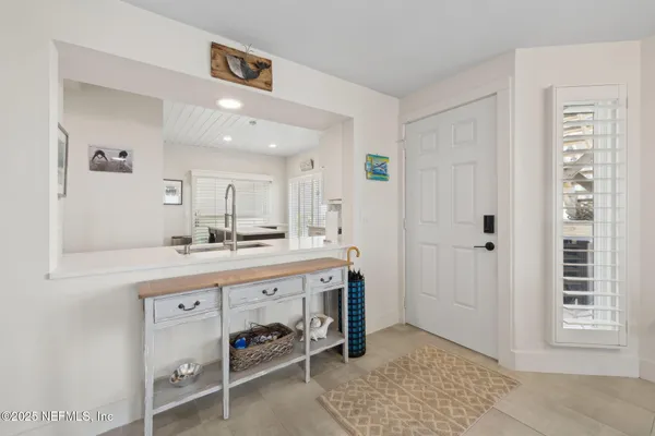 a view of a dining room with furniture and window
