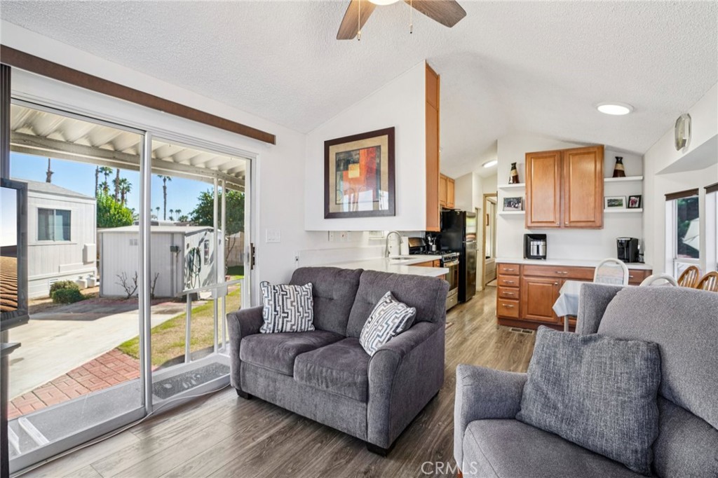 81620 Ave 49, Unit 174 Indio, CA 92201 - Photo 12 of 37 a living room with furniture and a large window