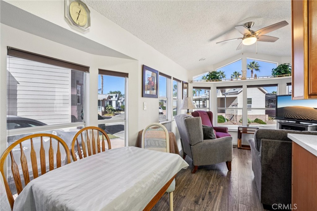 81620 Ave 49, Unit 174 Indio, CA 92201 - Photo 13 of 37 a living room with furniture a fireplace and a window