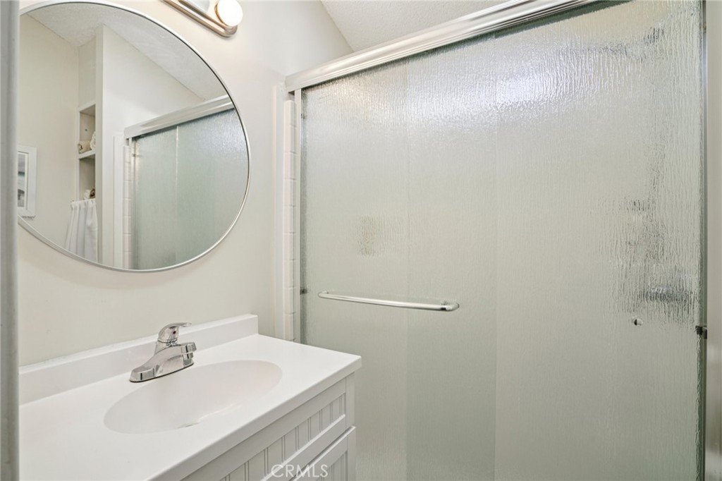 81620 Ave 49, Unit 174 Indio, CA 92201 - Photo 23 of 37 a bathroom with a sink and mirror