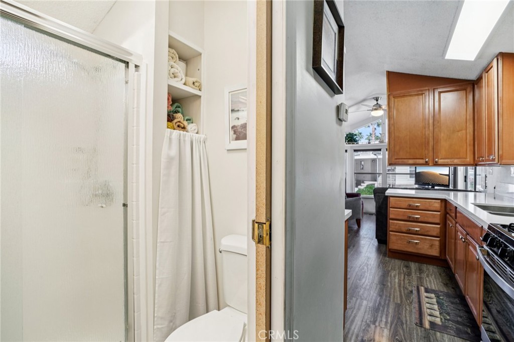 81620 Ave 49, Unit 174 Indio, CA 92201 - Photo 24 of 37 a bathroom with a sink a toilet and shower