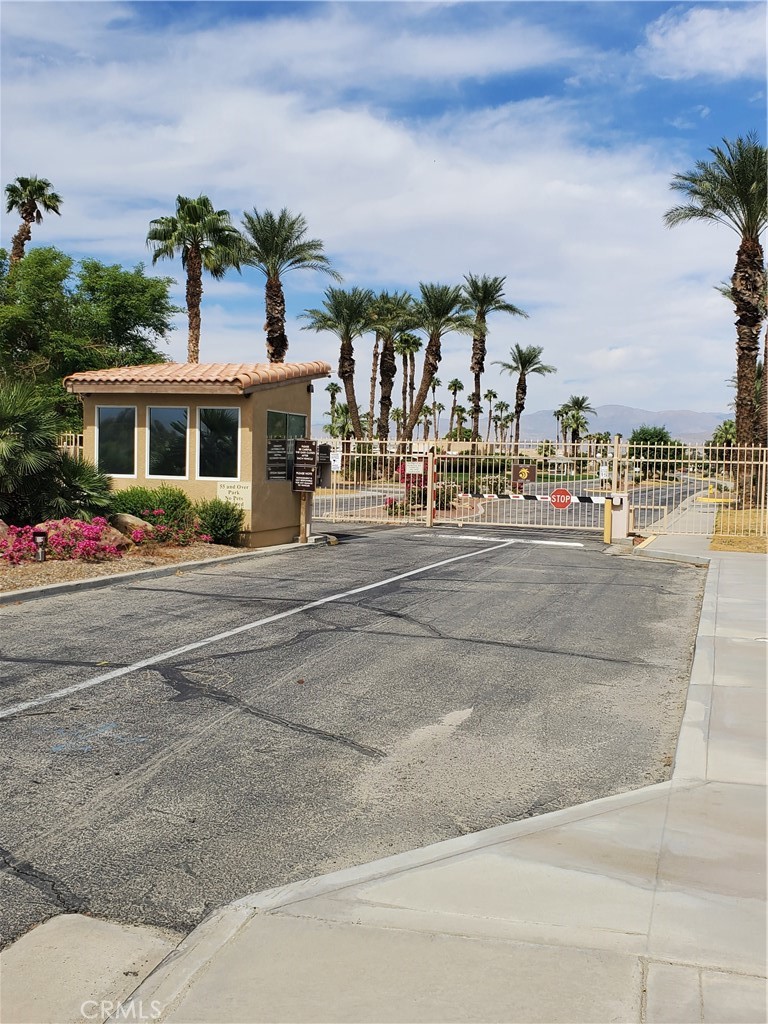 81620 Ave 49, Unit 174 Indio, CA 92201 - Photo 37 of 37 a front view of residential houses with yard