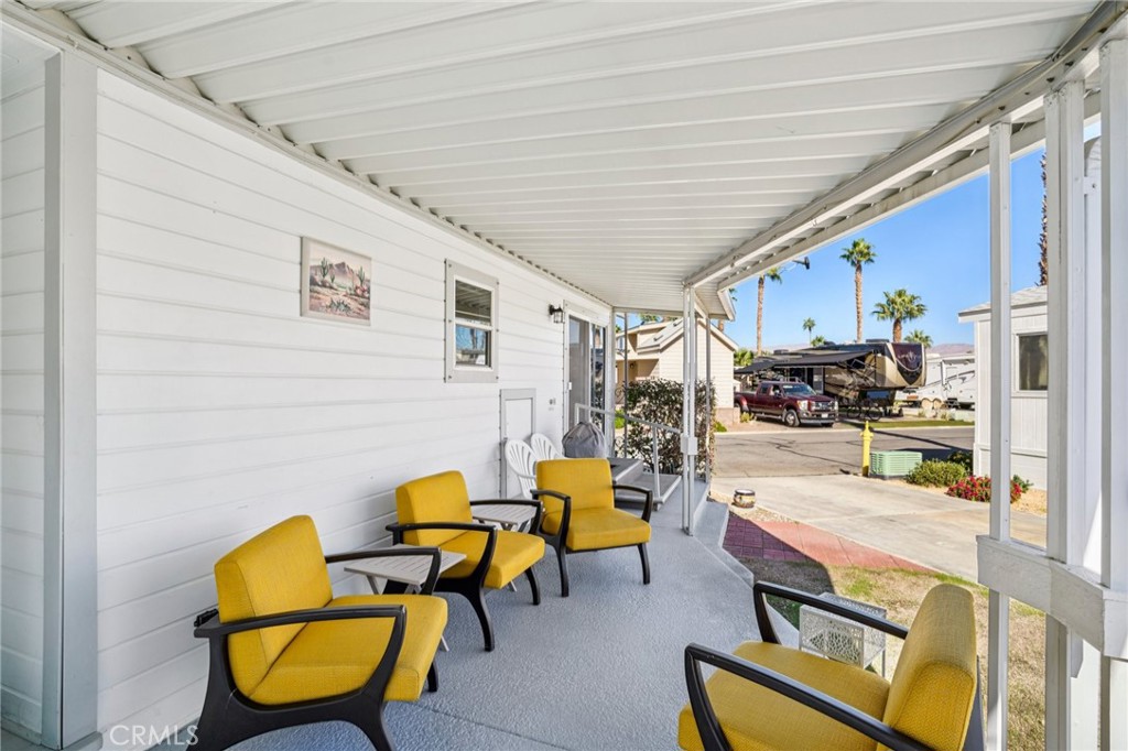 81620 Ave 49, Unit 174 Indio, CA 92201 - Photo 8 of 37 a building outdoor space with furniture