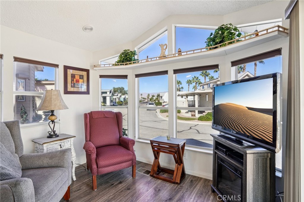 81620 Ave 49, Unit 174 Indio, CA 92201 - Photo 10 of 37 a living room with furniture and a window