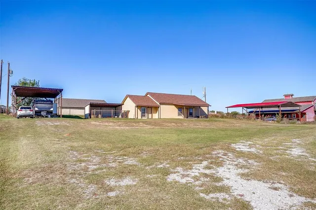 a swimming pool with outdoor seating and yard