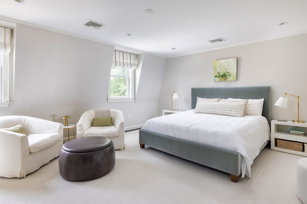 9 Ripley Street, Unit 1 Newton, MA 02459 - Photo 12 of 20 a bedroom with a bed and a couch