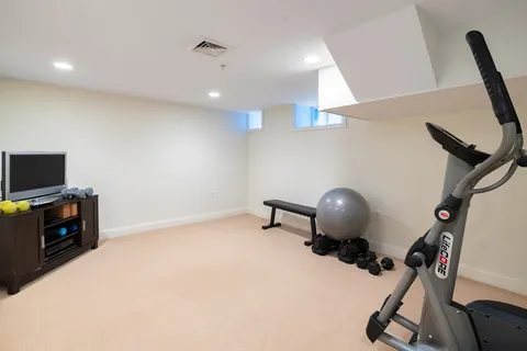 a room with furniture and a flat screen tv