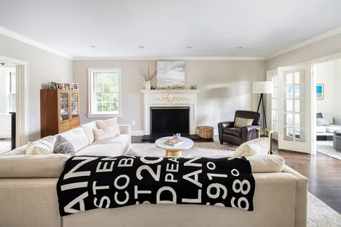 a bedroom with furniture and a fireplace