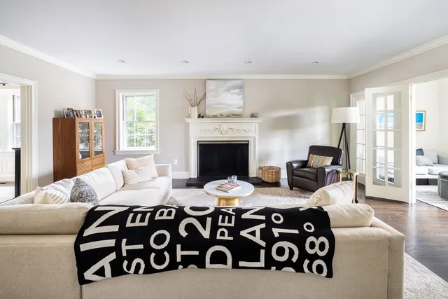 a bedroom with furniture and a fireplace