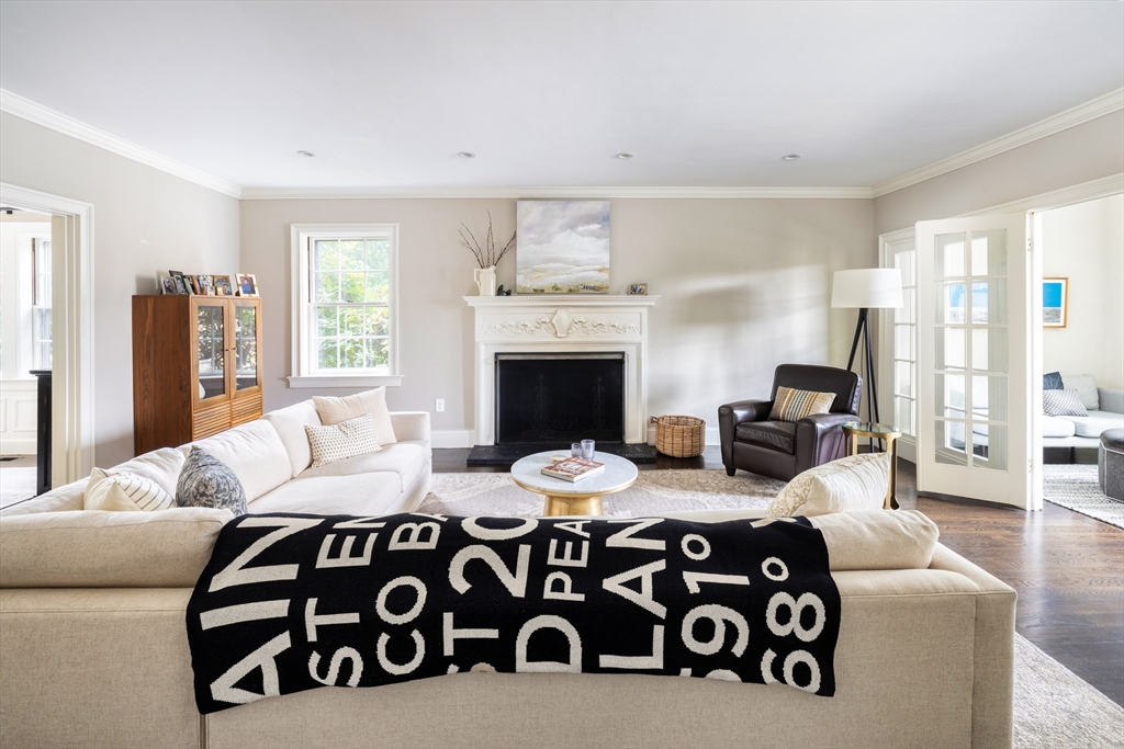 9 Ripley Street, Unit 1 Newton, MA 02459 - Photo 3 of 20 a bedroom with furniture and a fireplace