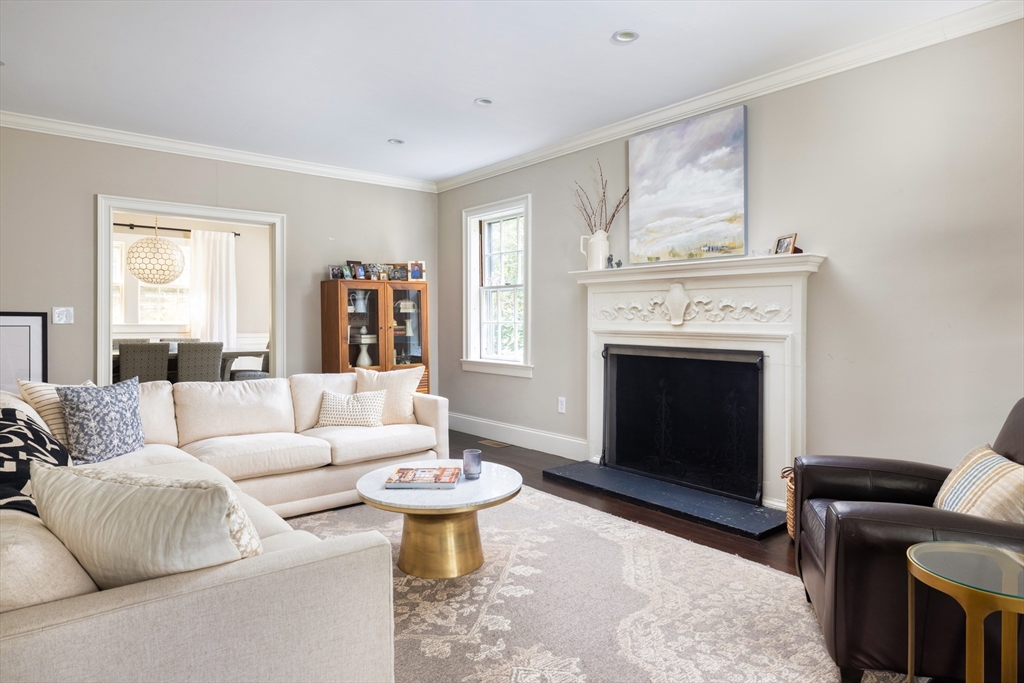 9 Ripley Street, Unit 1 Newton, MA 02459 - Photo 4 of 20 a living room with furniture a window and a fireplace