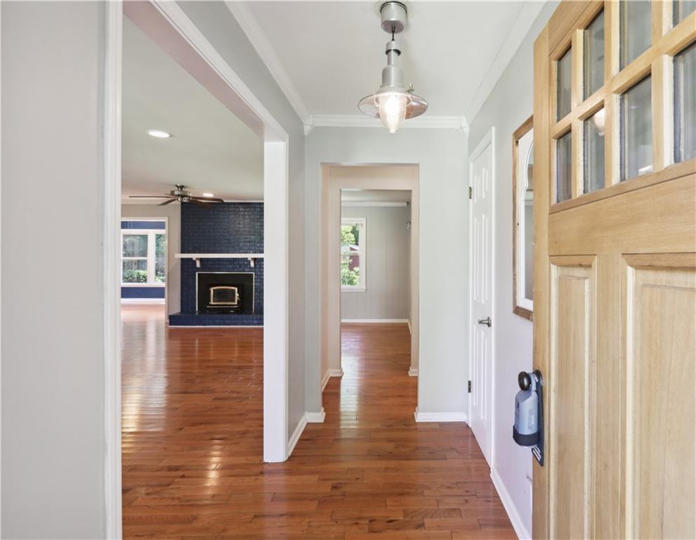 a view of livingroom with kitchen and hardwood