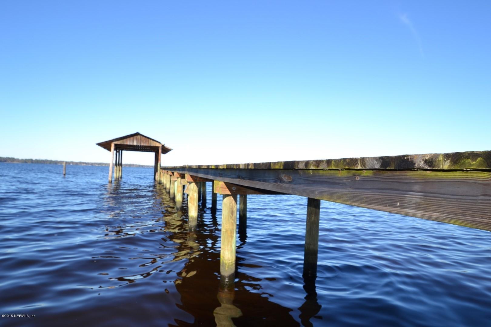 76 Harmony Hall Road Middleburg, FL 32068 - Photo 1 of 67 a view of a balcony with wooden floor and a table