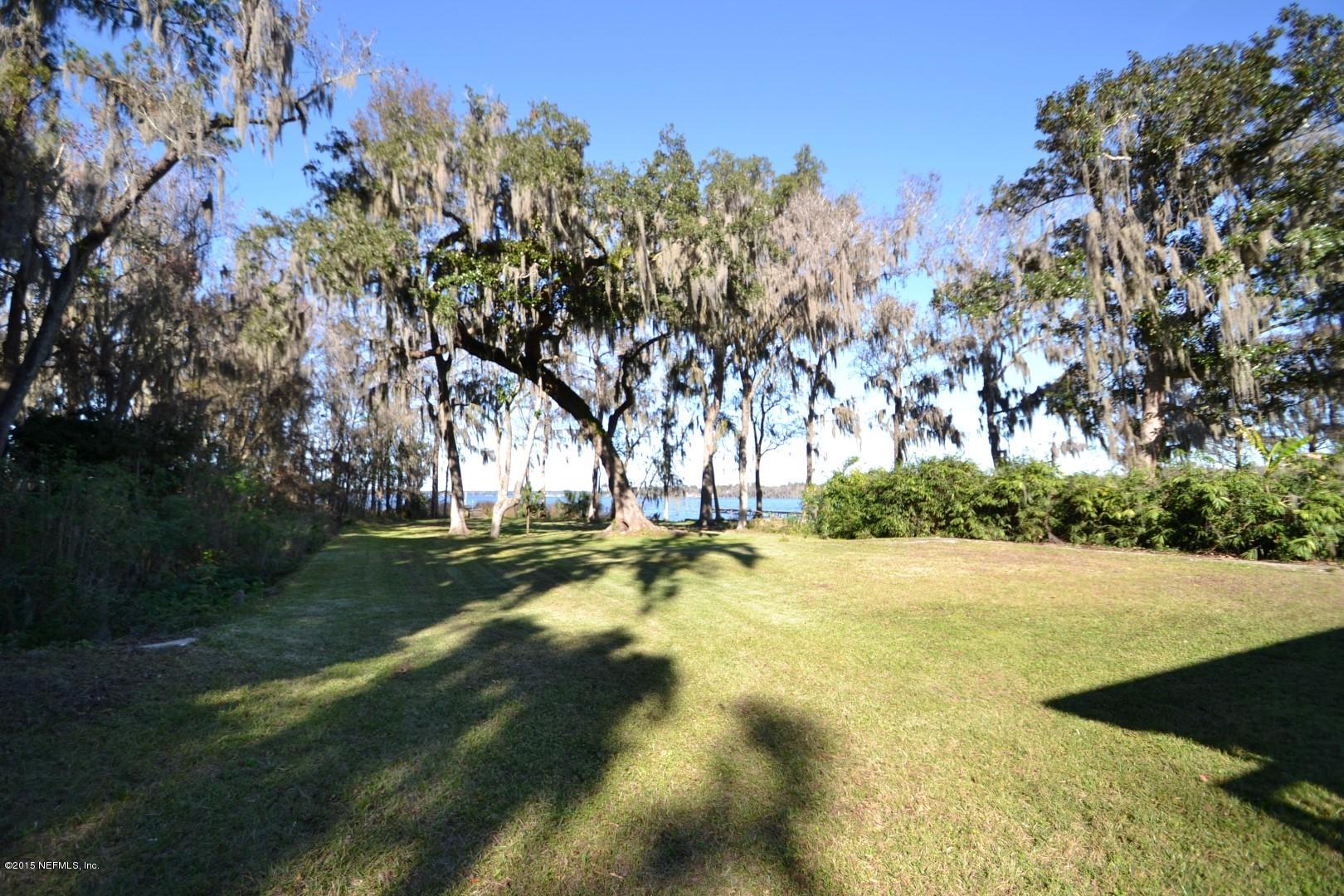 76 Harmony Hall Road Middleburg, FL 32068 - Photo 13 of 67 a view of swimming pool with an outdoor space and seating area